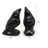Hand-carved black obsidian raven figurine with a distinct profile and textured finish.