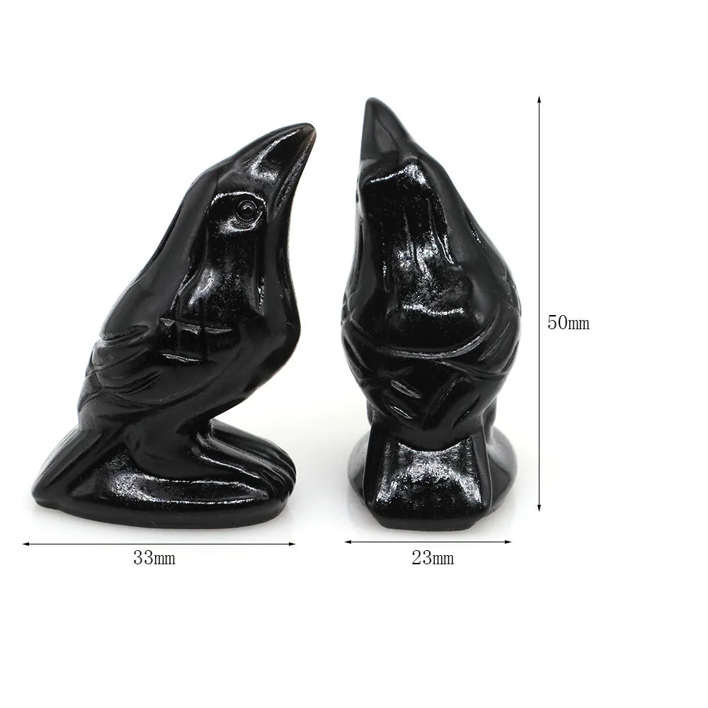 Hand-carved black obsidian raven figurine with a distinct profile and textured finish.