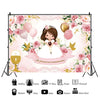 A floral and gold themed photography backdrop for a first communion celebration featuring a child.