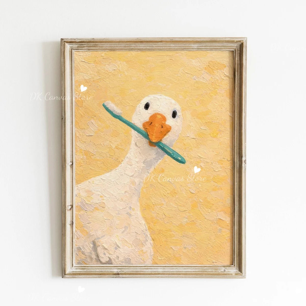 A painting of a white duck against a yellow background in a gold frame.