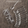 Clear plastic disposable spoons arranged on a brown surface with descriptive text.