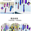 A collection of nine crystal prism sun catchers hanging by strings, showcasing various colors and facets.