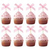 Four pink cupcake toppers featuring decorative bows for parties and celebrations.