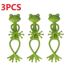 Three green frog-shaped plant support clips for tomatoes and climbing plants