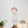 A crystal tree of life sun catcher wall decor with a circular frame and hanging crystal elements.