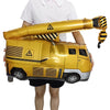 A golden construction truck foil balloon is being held by a person for party decoration.