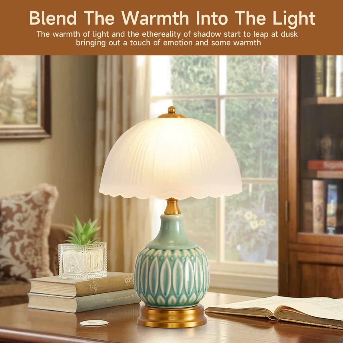 A ceramic table lamp with a pale green crackle glaze sits on a wooden table next to a book and window.