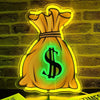 Neon dollar sign LED wall light shaped like a sack of gold on a brick background.