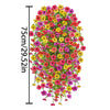 A vertical display of a vibrant artificial flower vine featuring mixed pink, yellow, and red blossoms.