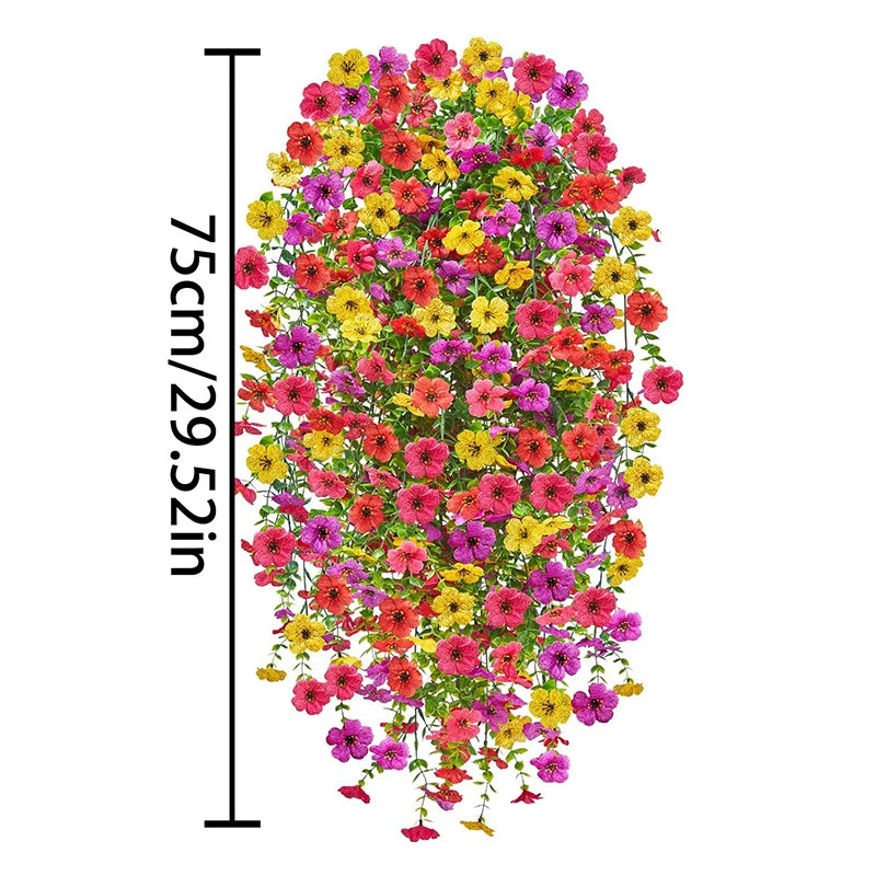 A vertical display of a vibrant artificial flower vine featuring mixed pink, yellow, and red blossoms.