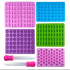 A silicone candy mold kit with various colored molds and droppers for making DIY chocolates and jellies.