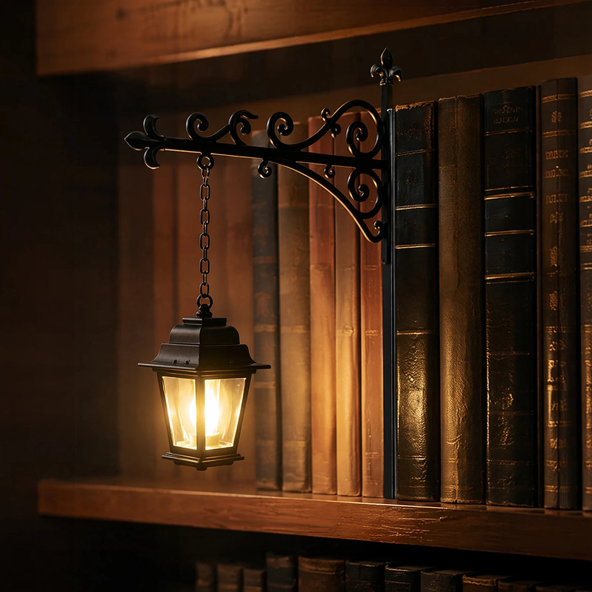 An antique wrought iron lantern hangs above a wooden bookshelf filled with old leather-bound books.