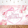 A pink heart-shaped birthday backdrop featuring pink confetti and balloons with a bow.