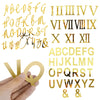 A set of gold acrylic alphabet and Roman numeral cake toppers.