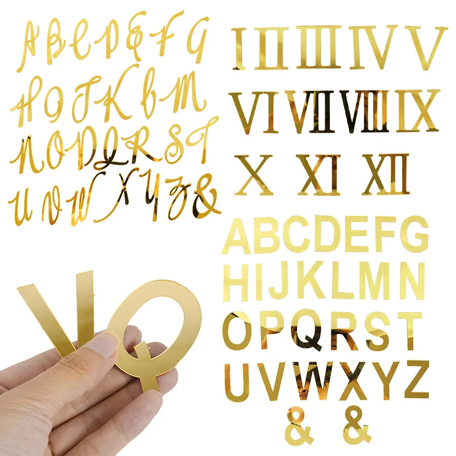 A set of gold acrylic alphabet and Roman numeral cake toppers.