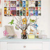 A display of colorful DIY diamond painting keychains hanging from a branch against a white background.