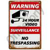 Vintage metal warning sign with text indicating 24 hour video surveillance and no trespassing