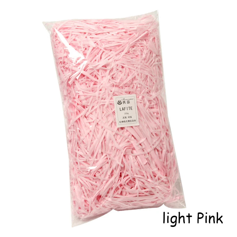 Bag of light pink crinkle paper shreds for gift boxes and party decor