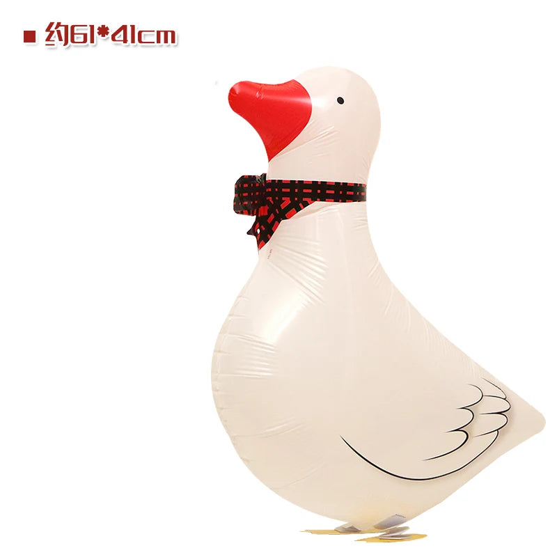 A white cartoon duck foil balloon with a red beak and a black checkered ribbon decoration.