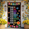 A dark banner decorated with yellow and orange sunflowers, butterflies, and colorful text welcoming students back to school.