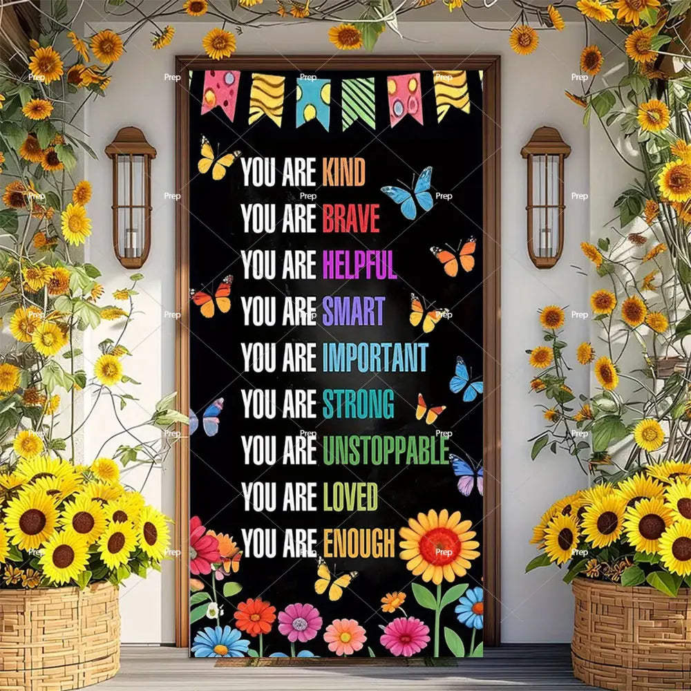 A dark banner decorated with yellow and orange sunflowers, butterflies, and colorful text welcoming students back to school.