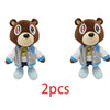 A pair of brown bear plush toys with graduation theme outfits and blue boots.