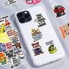 A white smartphone features various funny text decals about work and luck, including sayings like This Isn't Magic It's Labor