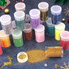 A collection of 32 colorful glitter mixes in various shades are displayed on a dark surface for nail art and DIY crafts.