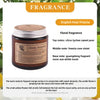 A jar of fragrance oil for a candle featuring a brown label and a silver lid.