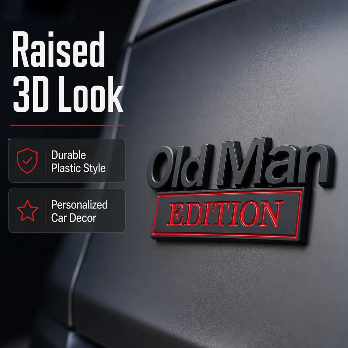 A black Old Man Edition car door emblem with a raised 3D look and red lettering.