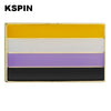 A rectangular lapel pin featuring five horizontal stripes of yellow, white, purple, black, and a gold border.