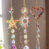 A set of three crystal rainbow sun catchers featuring star, sun circle, and heart designs.
