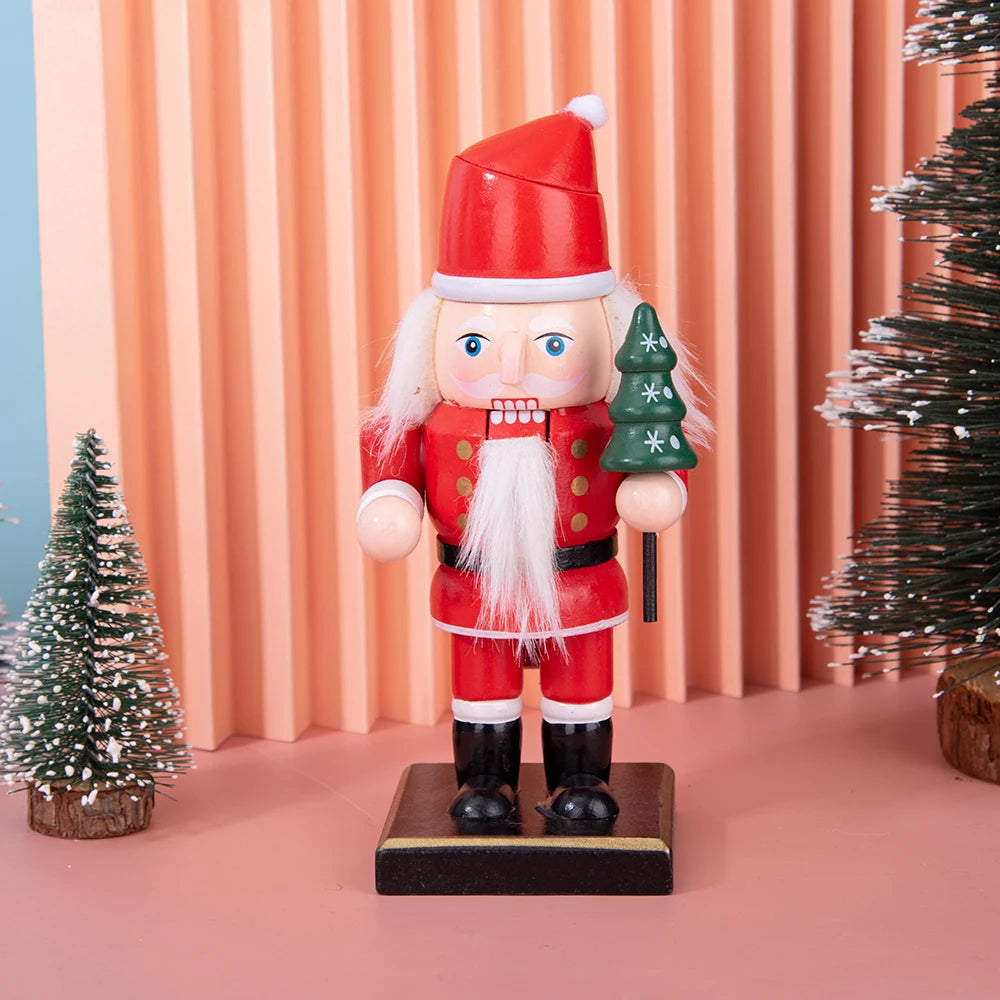 A wooden nutcracker soldier ornament dressed in a red Santa hat and red uniform stands on a dark base.