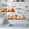 A white cabinet features butterfly wall decals and kitchen decor elements like a teapot, spices, and baked goods.