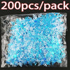 A package of 200 pieces of blue frosted snowflake confetti for holiday decorations.