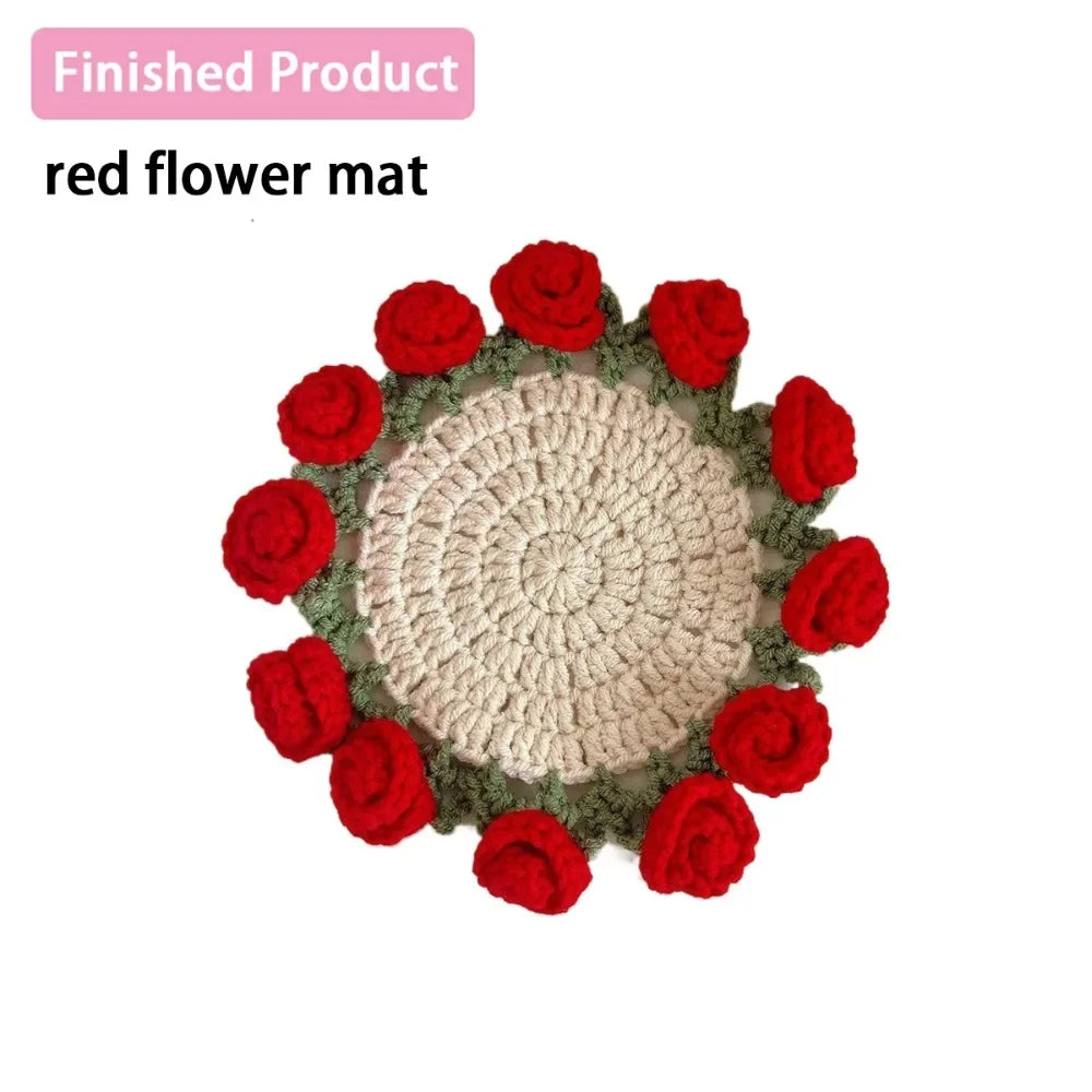 A finished product of a red flower mat made from hand-crocheted fabric flowers.