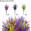 A collection of four artificial lavender stems in purple, blue, and yellow for outdoor decoration.