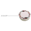 A stack of round cardboard cake boards decorated with pink and burgundy floral patterns.