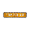 A rectangular, weathered yellow aluminum street sign with the text YOUR TEXT HERE stamped on it.