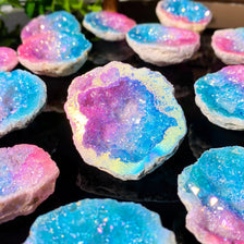 Iridescent blue and pink agate crystal geode stone with sparkling inclusions