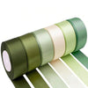 Roll of satin silk ribbon in olive green, cream, and light green colors.