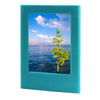 A teal magnetic double-sided frame displaying a scenic view of the ocean and sky with clouds.