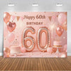 A pink and gold balloon backdrop for a 60th birthday party featuring large foil number balloons and confetti.