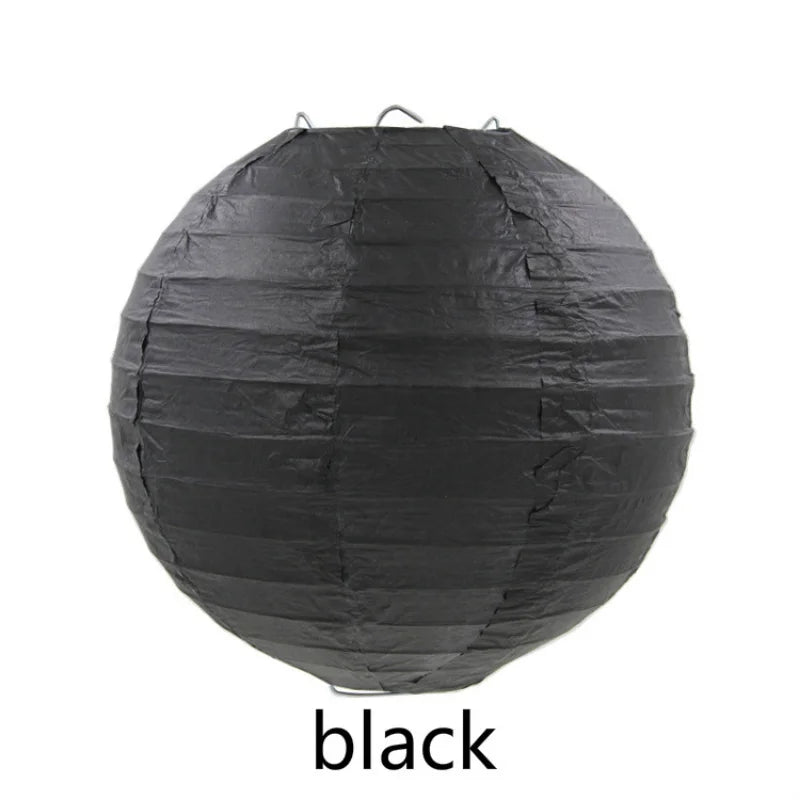 A spherical black decorative paper lantern.