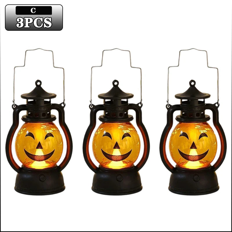 Three black pumpkin lanterns with glowing orange LED faces for Halloween decoration