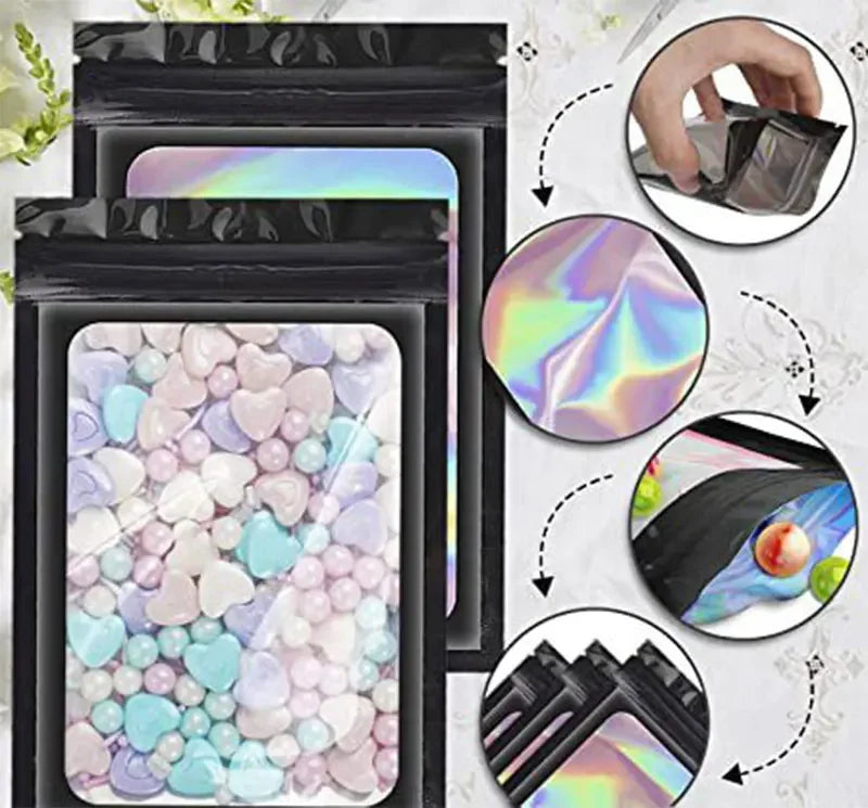 Holographic ziplock bags for jewelry and small item storage displayed in a black holder.