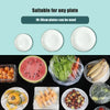 Various white plates and food items are shown with elastic covers for food preservation.