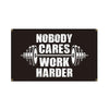 A black banner with white text that reads Nobody Cares Work Harder and features a barbell graphic.