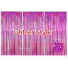 Three vertical strands of shimmering pink glitter fringe curtains hanging down.