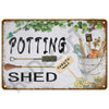 Vintage metal tin sign with hand-painted text POTTING SHED and illustrations of garden tools and greenery.